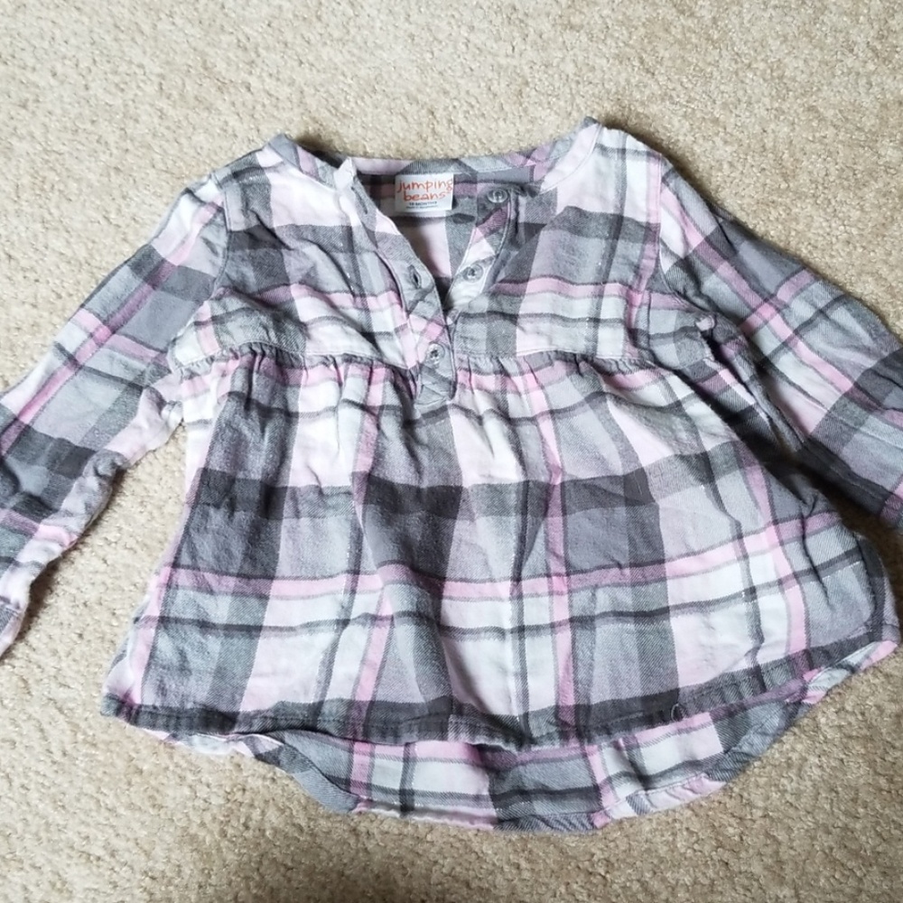 Pink and grey long sleeve top.